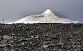 The peak glacier seen from the trail, rising from a nearly flat plateau.