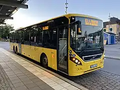 Another yellow regional bus at the Uppsala central station.