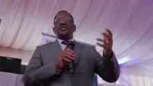 Keriako Tobiko holding a microphone and talking