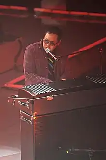 Kero One playing Fender Rhodes at a concert in 2009