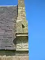 The sundial and Cunningham 'Y' 'Fork-Over' on the gable of the Glencairn Aisle.