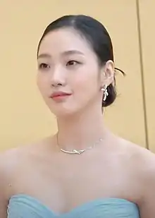 Kim looking leftwards