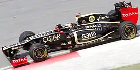 Kimi Räikkönen driving the Lotus E20 at the 2012 Malaysian Grand Prix.