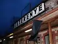 Building of railway station at Kisterenye on the line 84 with a black flag for the memorial of the passenger transportation on the line.