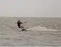 Kiteboarder edging his board