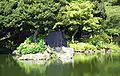 A large flat rock on an island in Korakuen garden in Tokyo, which represents a turtle's head.