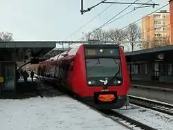 An S-train with coupler cover on the F line at Ålholm Station