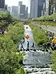 Cheonggyecheon, a landscaped urban stream with vegetation along its shore