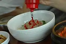 Gochujang is usually added to the top of hoedeopbap
