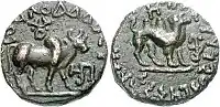 Kujula Kadphises Tetradrachm. Obv Brahma bull standing right, with Buddhist Triratana above. Blundered Greek legend. Rev Camel standing right. Kharoshthi legend Maharayasa Rayatirayasa Kuyula Kara Kapasa.