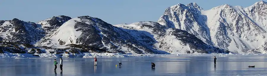 Children of Kulusuk play on the frozen sea