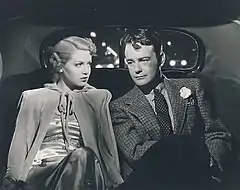 Woman and man seated in car