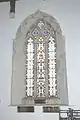 14th century window in south aisle of nave with three lights, ogee tracery and cusped rere-arch
