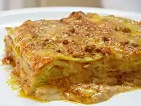 Green lasagna (made with spinach in the dough), with ragù, Parmesan and bechamel, typical of Bolognese cuisine
