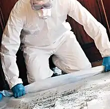 Man removing lead paint