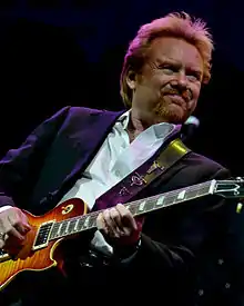 Musician Lee Roy Parnell playing an electric guitar.