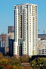 The 31 story building from the south. The building is a rectangular prism with some setbacks on the side facing the viewer.