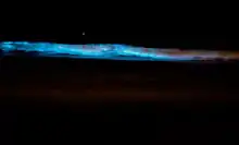 Surf glowing blue in Southern California