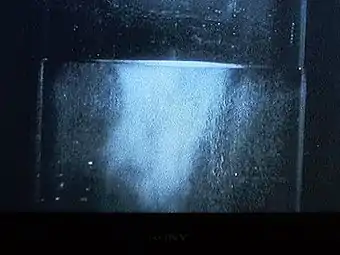 Liquid helium (in a vacuum bottle) at 4.2&nbsp;K (−268.95&nbsp;°C) and 1&nbsp;bar (15&nbsp;psi) boiling slowly.