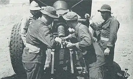 A M114 155 mm howitzer is loaded during training at Fort Leonard Wood, Missouri in 1941