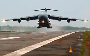 Military C-5 Aircraft from Travis Air Force Base takes off in Sierra Leone