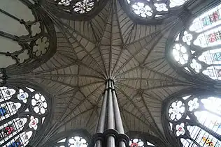 A ceiling shaped like an eight-pointed star, supported by a central pillar.