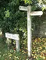 Section 61 - One of a number of signposts in the village showing the direction of the path