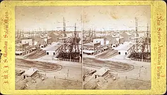 Stereoscopic view of Long Wharf in Boston, United States, c. 19th century, jutting into Boston Harbor