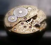 Very stylized acanthus motif engraving on an ennobled watch movement