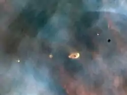 Image 28Hubble image of protoplanetary discs in the Orion Nebula, a light-years-wide stellar nursery probably very similar to the primordial nebula from which the Sun formed (from Formation and evolution of the Solar System)