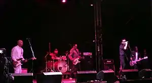 The MC5 and Motörhead's Lemmy Kilmister in 2005. L-R: Wayne Kramer, Dennis Thompson, Michael Davis, Lemmy, and Gilby Clarke.