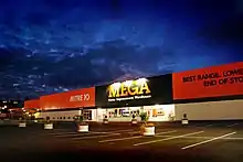 The front of the Glenfeild, Auckland Mitre 10 MEGA store at dusk