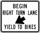 Begin right turn lane yield to bikes
