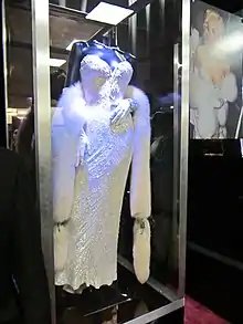 The white dress on display, design of Bob Mackie
