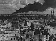 burning Brabag factory in Magdeburg, hit by Allied bombing, January 1945.