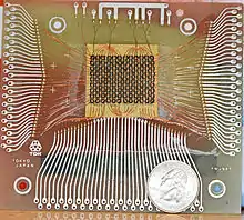 Magnetic-core memory, 18×24 bits, with a US quarter for scale