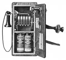 Image 391917 wall telephone, open to show magneto and local battery (from History of the telephone)