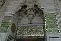 Muqarnas and calligraphy over the mosque's entrance portal