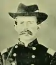 Old picture of an American Civil War officer with mustache and hat