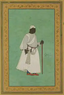 17th-century painting of a man in ceremonial dress with a staff, against a green background
