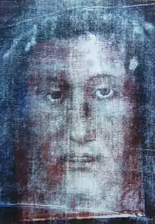 Superposition of the Veil of Manoppello on an inaccurate artistic reimagining of the negative of the Shroud of Turin