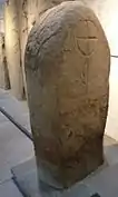 10th- or 11th-century carved stone slab, showing a linear ring-cross