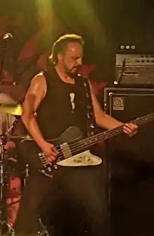 Evans performing with Rose Tattoo in 2018