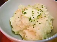 Close-up view of mashed potatoes with butter and chives