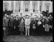 Rogers to the right of President Calvin Coolidge in 1928.