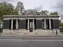 A rectangular monument in the shape of a vaulted colonnade