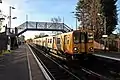 A Merseyrail Class 507 waits at the Ormskirk-bound platform.