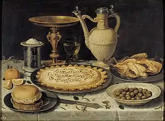 Clara Peeters (1594–1657) Table with Orange, Olives and Pie