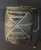 A color picture of a black-on-white pottery vessel
