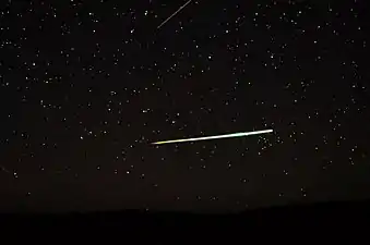Sporadic bolide over the desert of Central Australia and a Lyrid (top edge)